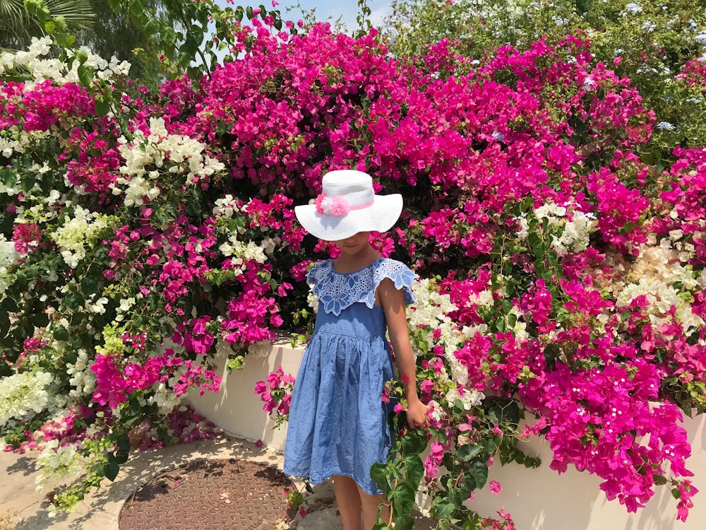 People sorting various types of waste into different bins for recycling
